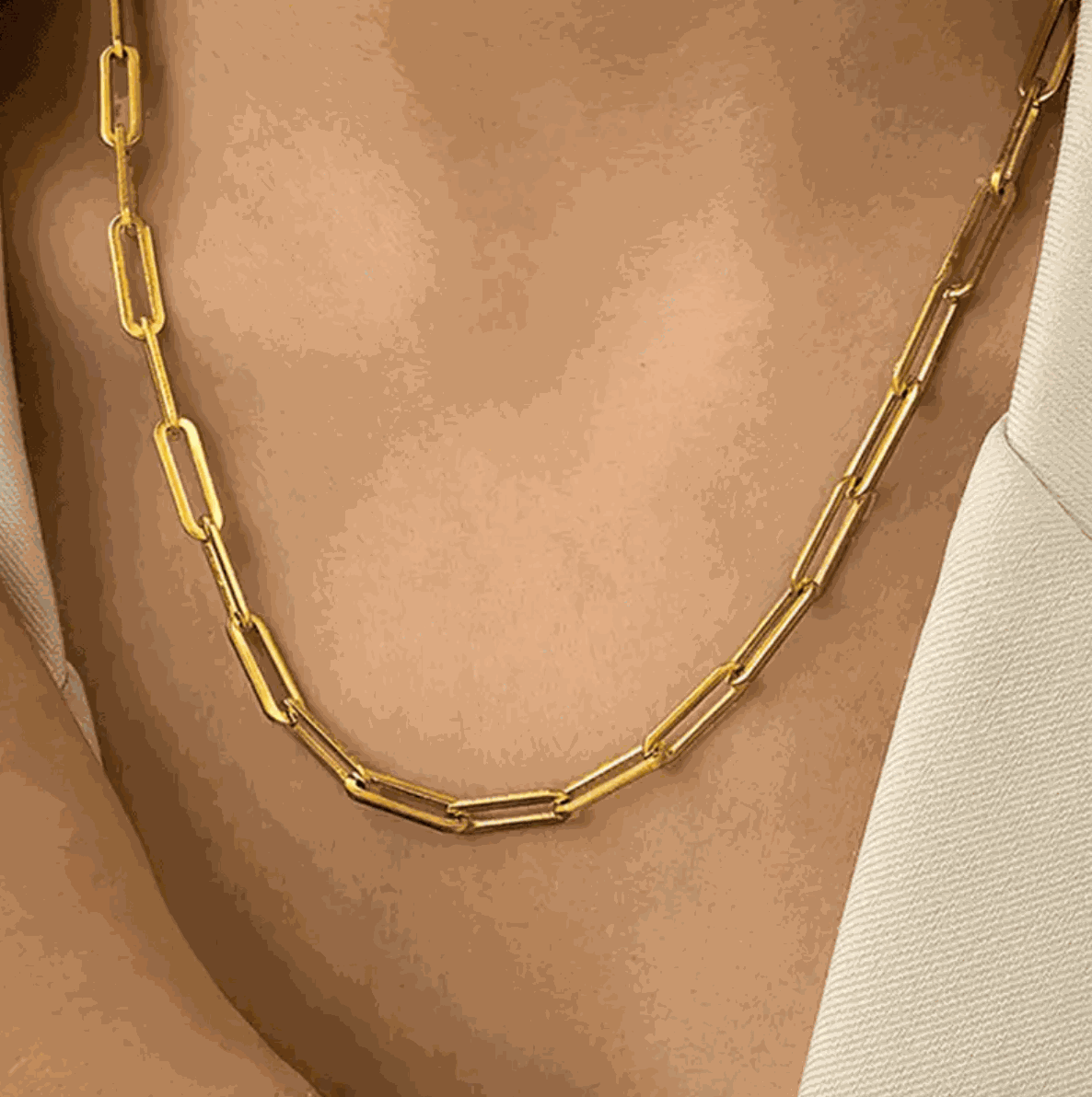 Elegant golden link chain necklace showcased on a model, perfect for stylish layering or solo wear.