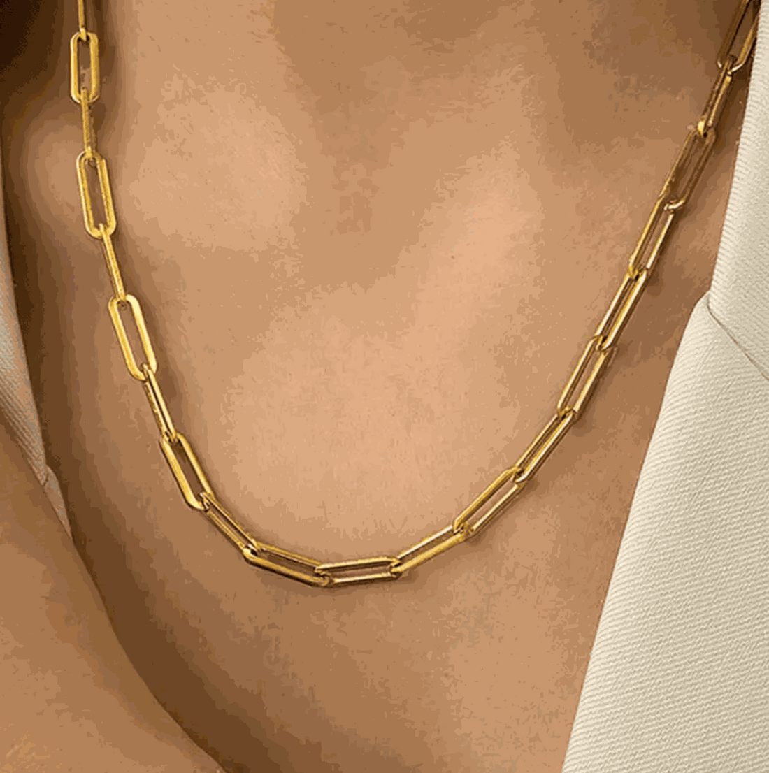 Elegant golden link chain necklace showcased on a model, perfect for stylish layering or solo wear.